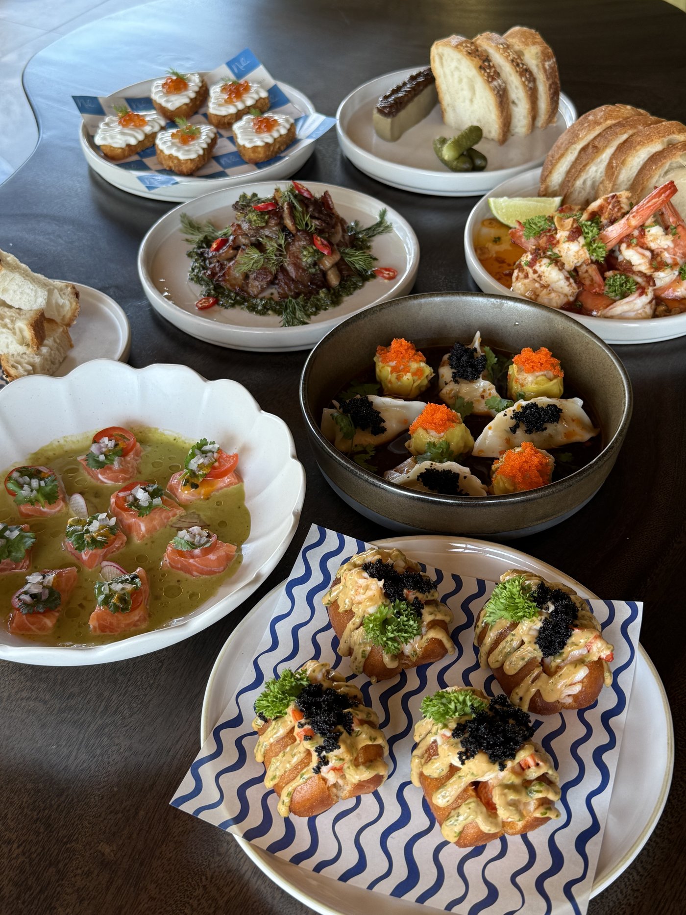Sharing plates spread across the table at Nahm, Bangrak, Koh Samui