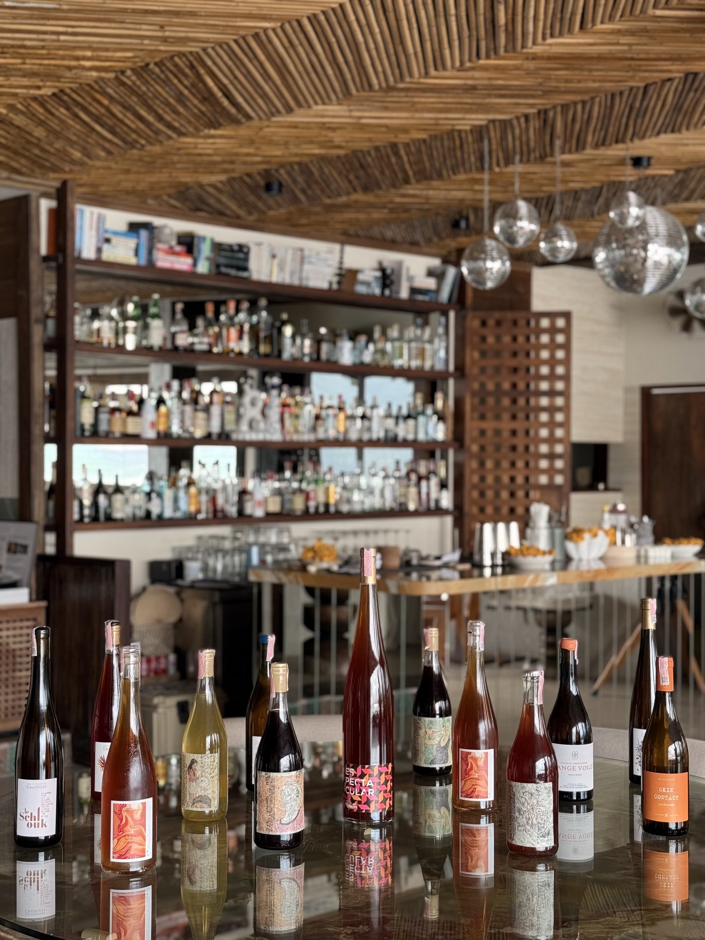 Natural and orange wine bottles at the Nahm bar, Bangrak, Koh Samui